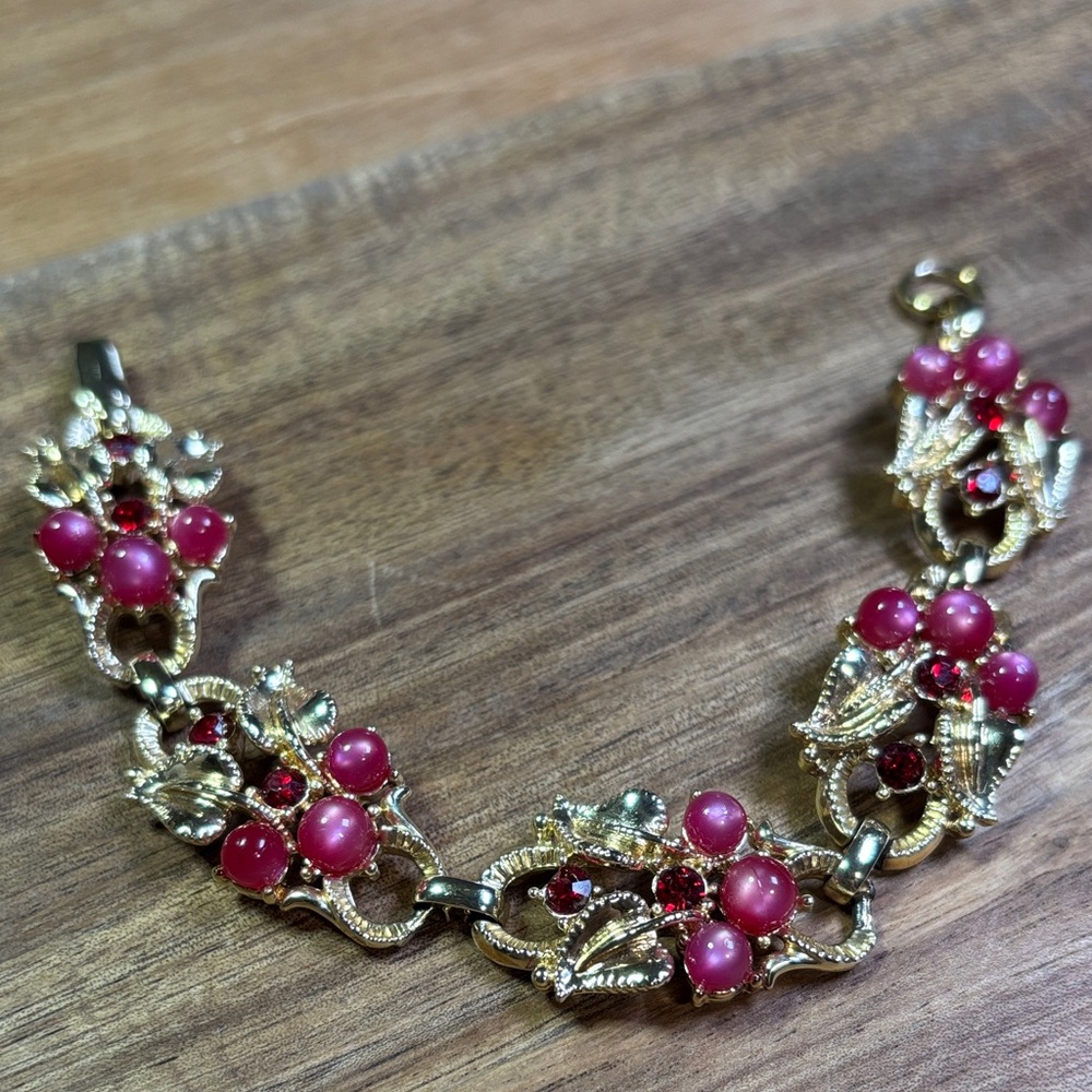 Star signed gold tone pink bracelet